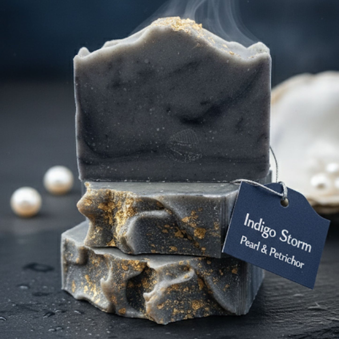 Handcrafted soap bar with deep indigo, gray, and black marbled swirls, evoking the fresh intensity of a summer storm. Clean, cool, and captivating.