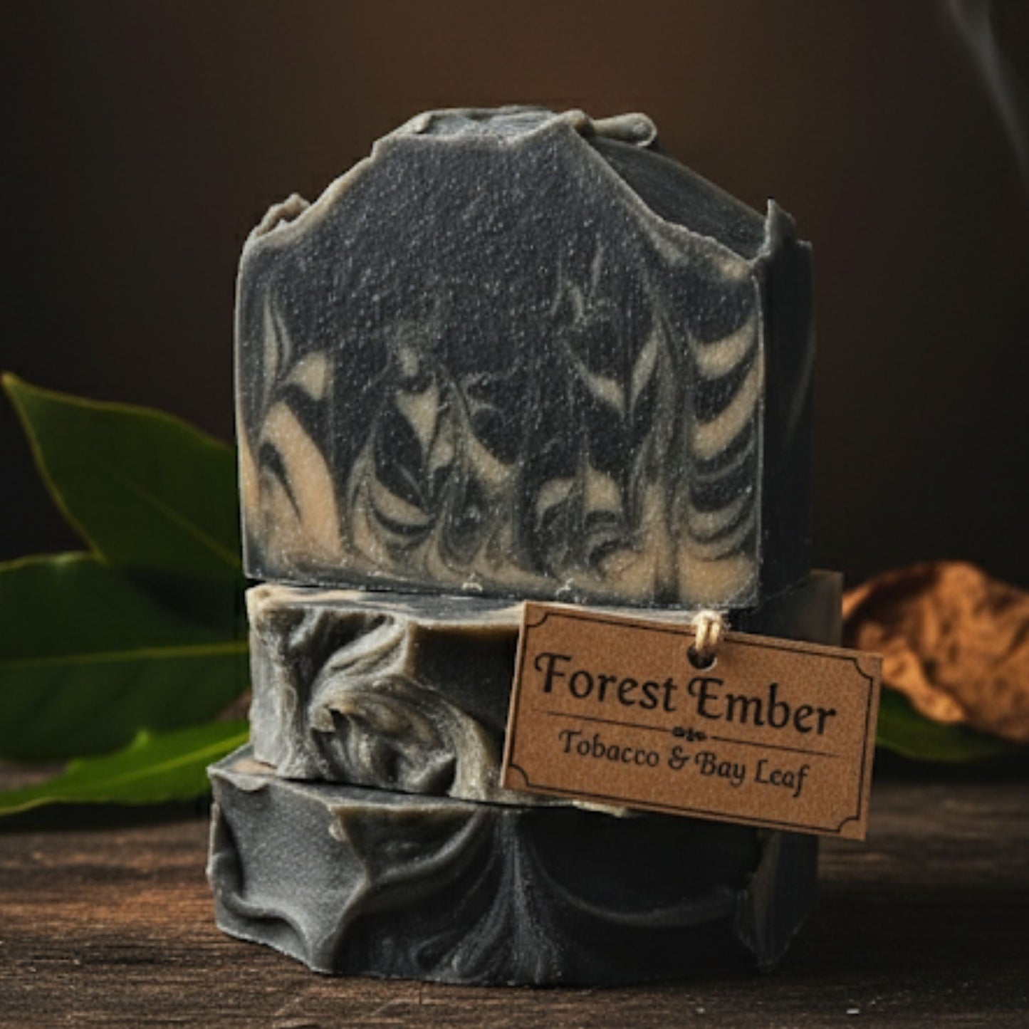 Handcrafted soap bar with deep earthy tones of brown, black, and coppery red swirls, inspired by the warmth of burning wood and crisp forest air. Bold, smoky, and rugged.