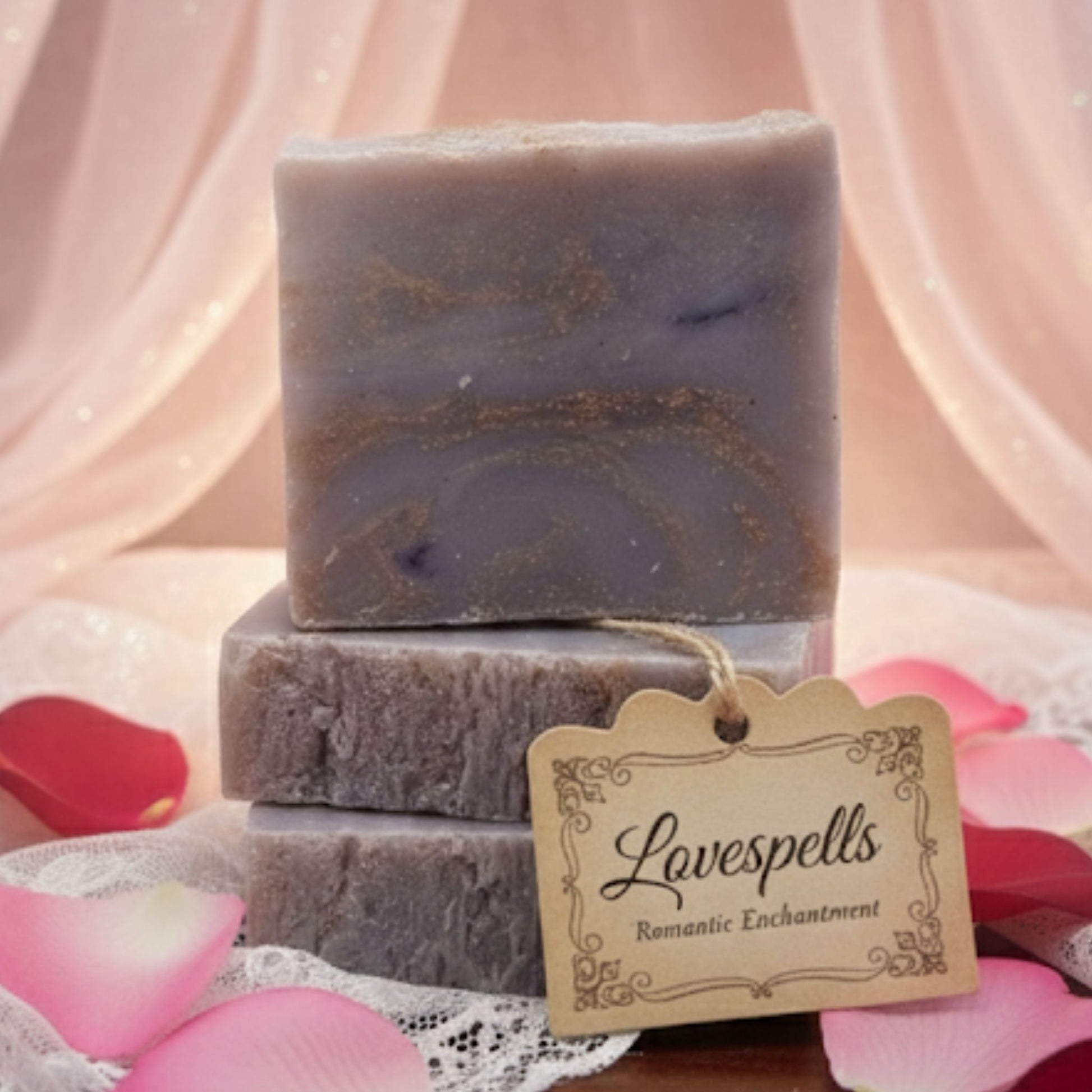 Handcrafted soap bar with soft pink, lavender, and ivory swirls, inspired by enchanting floral and fruity notes. Feminine, flirty, and magically alluring.