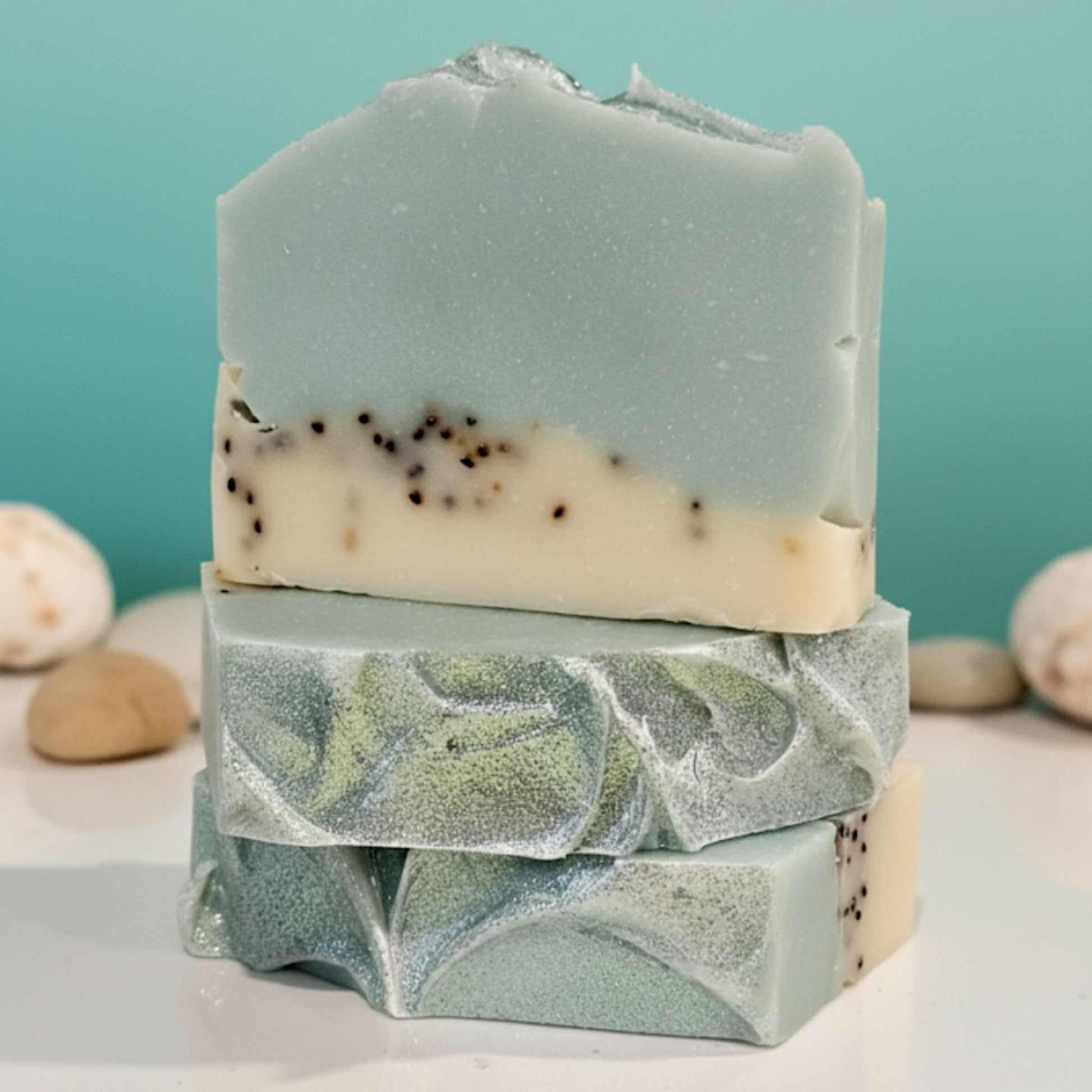 Handcrafted soap bar with soft blue, turquoise, and white swirls, capturing the clean and airy scent of salty ocean air and gentle waves. Refreshing, coastal, and uplifting.